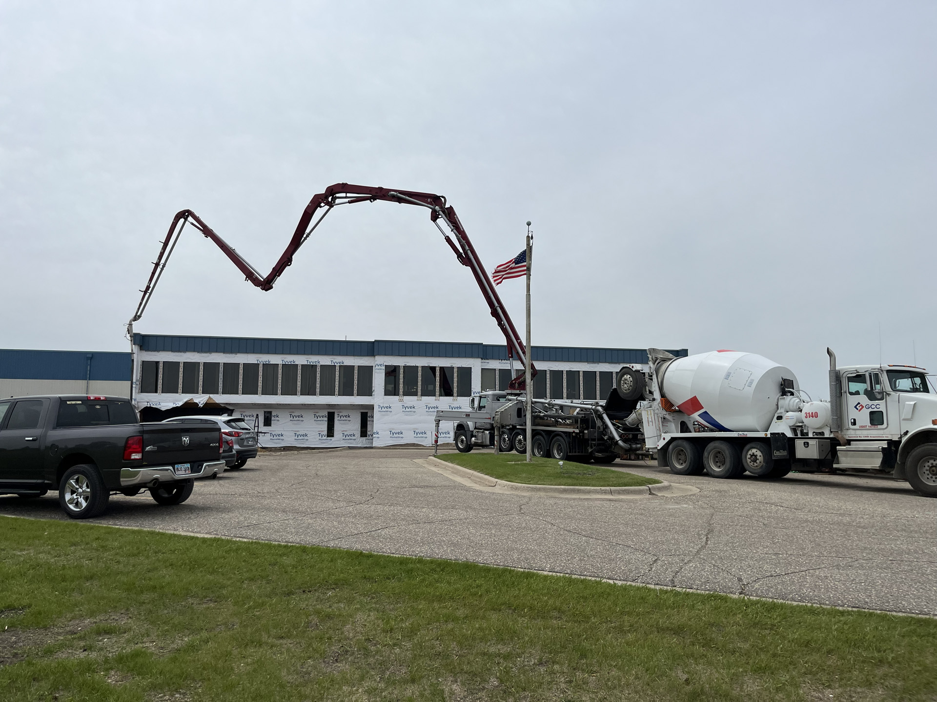 Concrete boom pump at a commercial building site